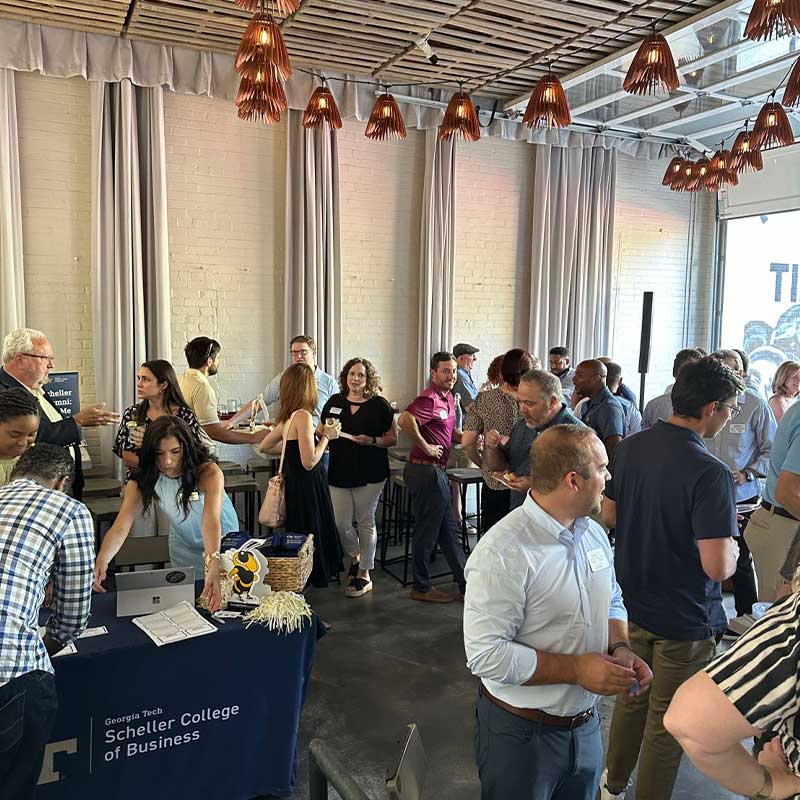 MBA alumni at the alumni event.